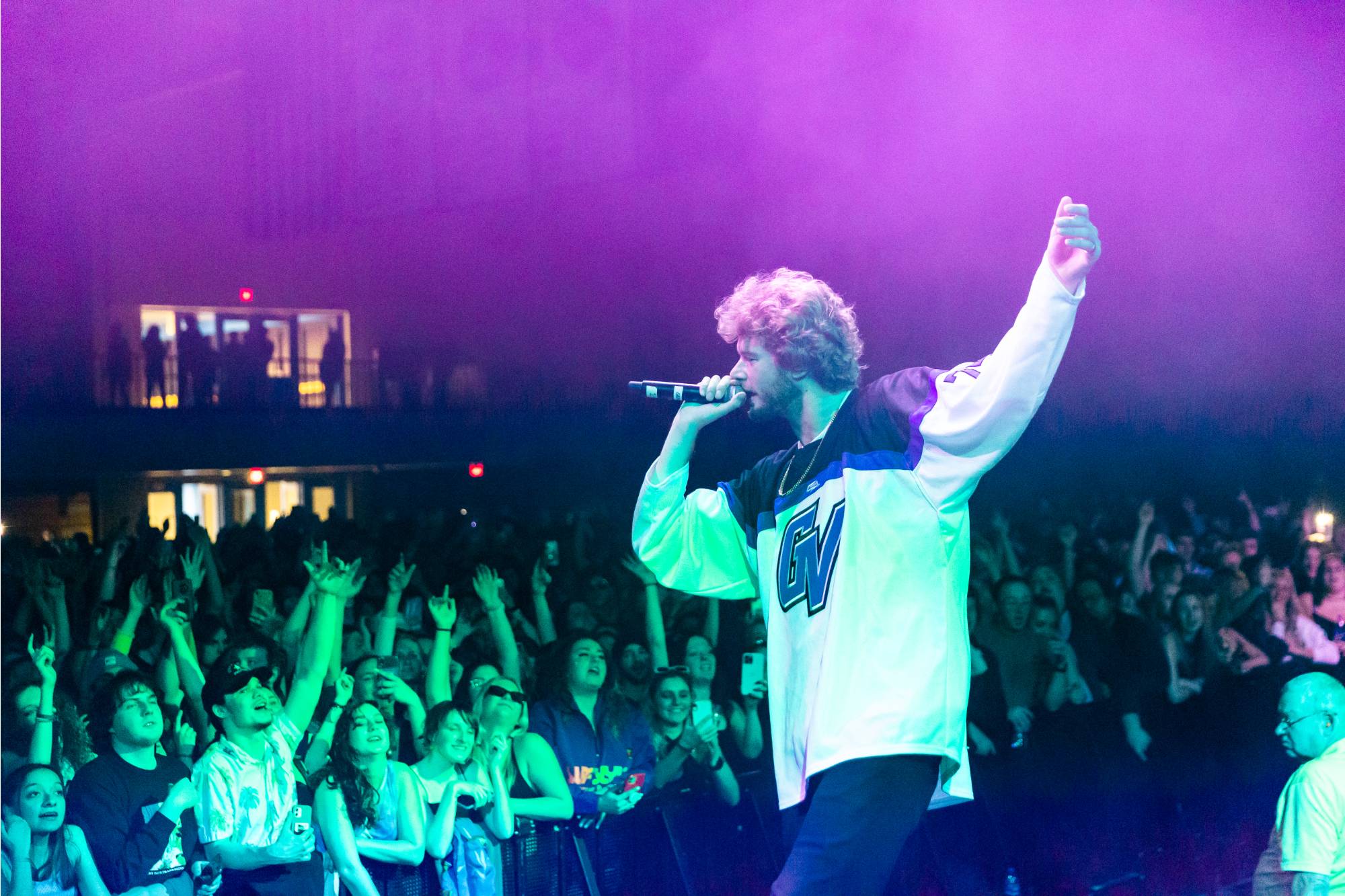 Yung Gravy performing as students cheer